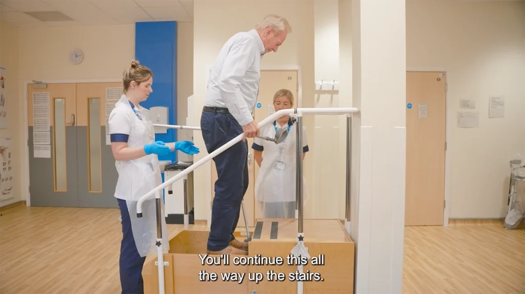 man walking up the stairs during physitherapy